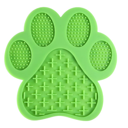 Green LickEase silicone lick mat for dogs and cats — BPA-free slow feeder pad on bathroom floor



