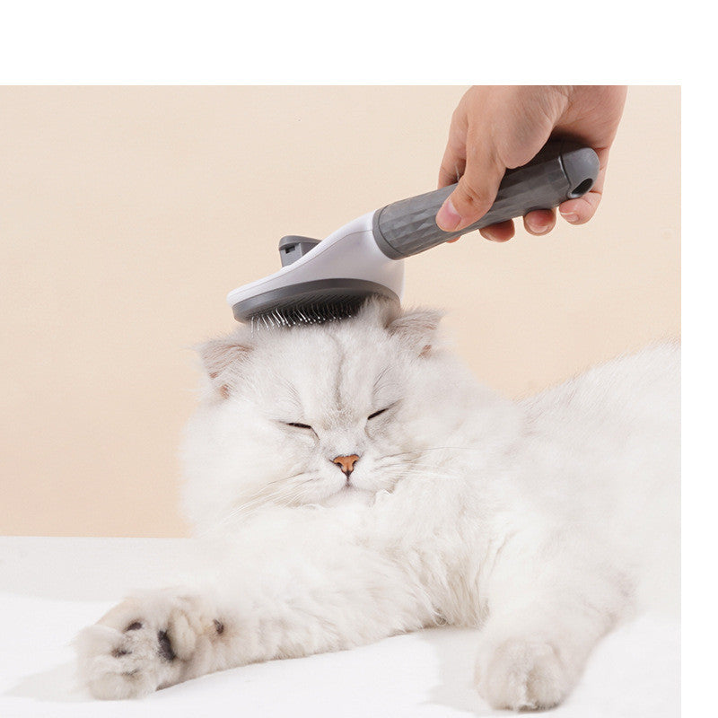 GroomPro pet grooming brush being used to brush a cat or dog — removes loose fur gently during grooming

