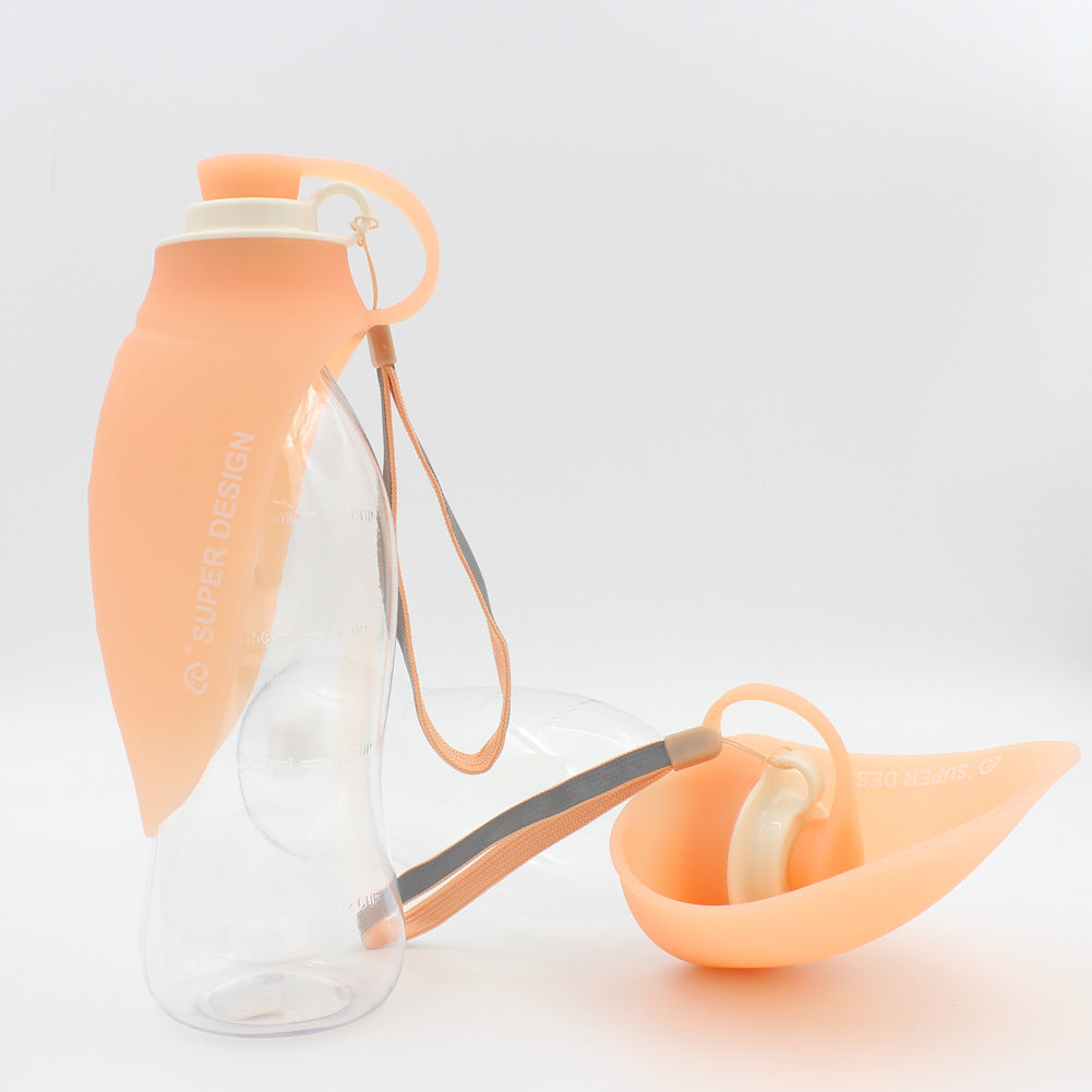 Orange FlipSip portable dog water bottle with flip cup dispenser, lightweight and easy to carry