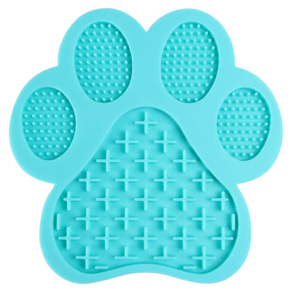 Sky blue LickEase silicone lick mat for dogs — suction base on tile floor during bath time

