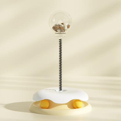 Yellow SpringSnack treat dispensing spring toy for cats and small dogs — front view on white background

